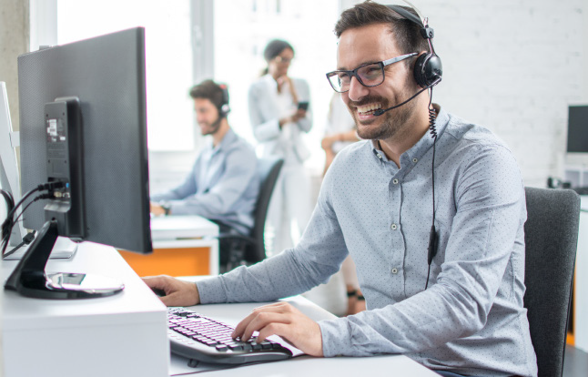 Customer service personnel conversing on a headset